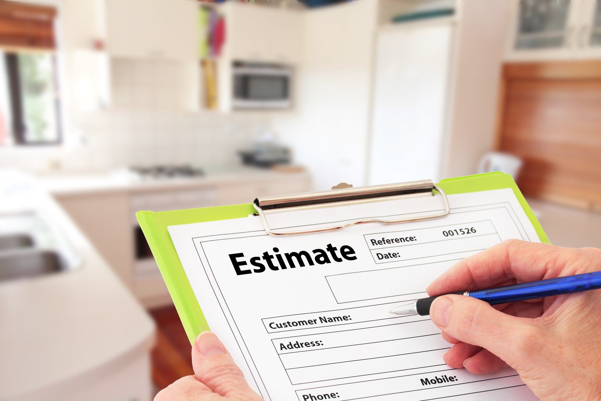 rooted-tree-specialists-omaha-4 Hand Writing an Estimate for Kitchen Renovation